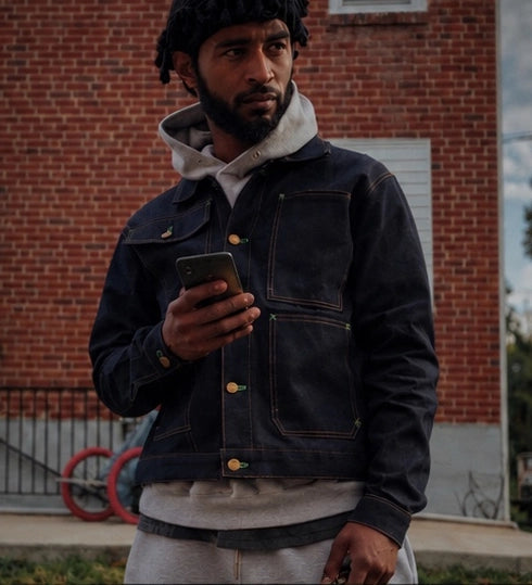 MASNUAT denim campaign against warm brick