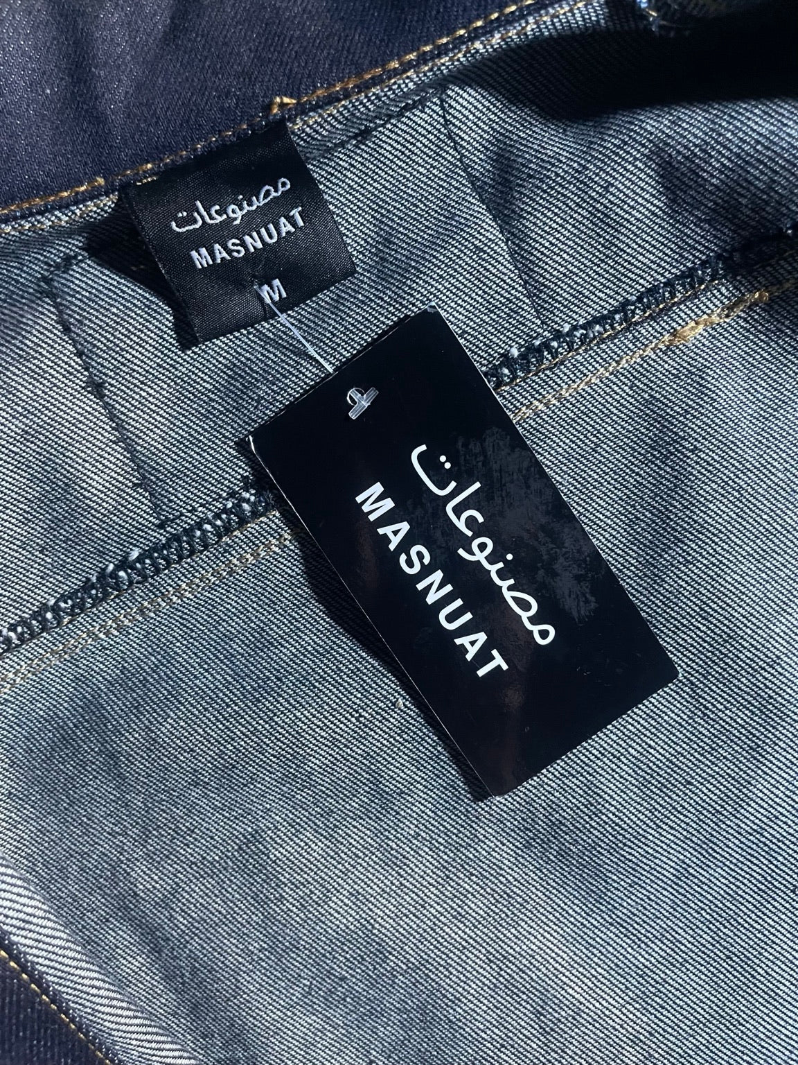 MASNUAT woven label and stitching inside denim